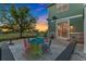 Charming patio setup with colorful table and chairs, perfect for al fresco dining and gatherings at 881 Kirby Ct, Watkins, CO 80137