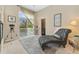 Sitting room with a view to an outdoor balcony, telescope and leather lounge seating at 881 Kirby Ct, Watkins, CO 80137