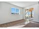 Bright basement room with sliding door access to backyard at 8791 Yellowcress St, Littleton, CO 80125