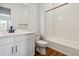 Clean bathroom, featuring a bathtub and white vanity at 8791 Yellowcress St, Littleton, CO 80125