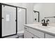 Clean bathroom with a shower and white vanity at 8791 Yellowcress St, Littleton, CO 80125