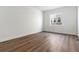 Bright bedroom with hardwood floors and large window at 8791 Yellowcress St, Littleton, CO 80125