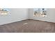 Bright bedroom with carpeted floors and large windows at 8791 Yellowcress St, Littleton, CO 80125