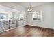 Modern dining room with hardwood floors and chandelier at 8791 Yellowcress St, Littleton, CO 80125