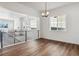 Modern dining room with hardwood floors and chandelier at 8791 Yellowcress St, Littleton, CO 80125