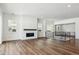 Spacious living room with hardwood floors and a fireplace at 8791 Yellowcress St, Littleton, CO 80125