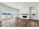 Open living area with hardwood floors and sliding glass doors to deck at 8791 Yellowcress St, Littleton, CO 80125
