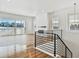 Living room with hardwood floors, fireplace, and modern staircase at 8791 Yellowcress St, Littleton, CO 80125