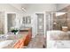 Large bathroom has granite countertop vanity, dual mirrors, and separate shower at 4519 Silver Mountain Loop, Broomfield, CO 80023