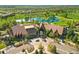 Aerial view showcasing the community clubhouse, landscaping, and parking at 4519 Silver Mountain Loop, Broomfield, CO 80023