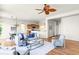 A stylish living room showcases an open floor plan, seamlessly connecting the dining and kitchen at 4519 Silver Mountain Loop, Broomfield, CO 80023