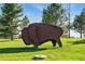 Outdoor sculpture of a bison set on a green lawn with trees in the background at 4519 Silver Mountain Loop, Broomfield, CO 80023