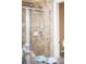 Tiled shower features a sliding glass door and chrome fixtures at 4519 Silver Mountain Loop, Broomfield, CO 80023