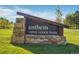 Community sign for Anthem Aspen Lodge Park with stone and wood design at 4519 Silver Mountain Loop, Broomfield, CO 80023