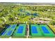 Aerial view of the community tennis courts surrounded by trees and green spaces at 4519 Silver Mountain Loop, Broomfield, CO 80023