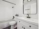 Clean bathroom, featuring a white vanity, large mirror, and bathtub at 10360 E Jewell Ave # 95, Aurora, CO 80247