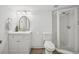 Basement bathroom with white vanity, toilet, and shower at 10360 E Jewell Ave # 95, Aurora, CO 80247