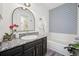 Clean bathroom with updated vanity and a patterned wall at 10360 E Jewell Ave # 95, Aurora, CO 80247