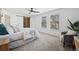 Main bedroom with sliding barn door and ensuite access at 10360 E Jewell Ave # 95, Aurora, CO 80247