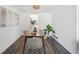 Modern dining room with wood table and gray chairs at 10360 E Jewell Ave # 95, Aurora, CO 80247