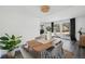 Bright dining area with wood table and view into living room at 10360 E Jewell Ave # 95, Aurora, CO 80247