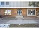 Welcoming front entry with steps leading to the door at 10360 E Jewell Ave # 95, Aurora, CO 80247