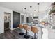 Updated kitchen features a breakfast bar and chalkboard accent wall at 10360 E Jewell Ave # 95, Aurora, CO 80247