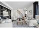 Bright living room with comfy seating and built-in shelving at 10360 E Jewell Ave # 95, Aurora, CO 80247