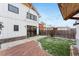 Backyard with a modern farmhouse exterior and a brick patio at 1375 Perry St, Denver, CO 80204