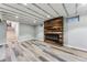 Finished basement featuring stylish flooring, a wood accent wall, and a modern fireplace at 1375 Perry St, Denver, CO 80204