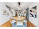 Elegant dining area with a round table, hardwood floors, and natural light at 1375 Perry St, Denver, CO 80204