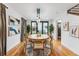 Elegant dining area with a round table, hardwood floors, and natural light at 1375 Perry St, Denver, CO 80204