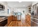 Spacious kitchen features wood cabinets, stainless steel appliances, and hardwood floors at 1375 Perry St, Denver, CO 80204