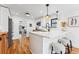 Bright kitchen with white cabinets, stainless steel appliances, and a breakfast bar at 1375 Perry St, Denver, CO 80204