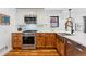 Well-lit kitchen features stainless steel appliances, a gas range, and bright countertops at 1375 Perry St, Denver, CO 80204