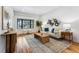 Bright living room with hardwood floors, white walls, stylish decor, and natural light at 1375 Perry St, Denver, CO 80204