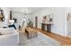 Bright living room with hardwood floors, white walls, stylish decor, and natural light at 1375 Perry St, Denver, CO 80204