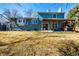 Exterior of the home with a wooden beam patio cover and big backyard at 10058 Lewis St, Broomfield, CO 80021