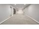 Spacious basement featuring neutral paint, carpet, and staircase access at 10058 Lewis St, Broomfield, CO 80021