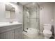 Bathroom with updated vanity and stand-up shower with glass door at 10058 Lewis St, Broomfield, CO 80021