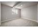 Cozy bedroom with a window providing natural light and neutral carpet at 10058 Lewis St, Broomfield, CO 80021