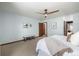 Spacious bedroom with blue walls, carpeted floors, and modern ceiling fan at 10058 Lewis St, Broomfield, CO 80021