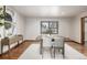 Elegant dining room with hardwood floors, table and chairs, with plenty of natural light, offering a comfortable atmosphere at 10058 Lewis St, Broomfield, CO 80021