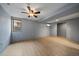 Finished basement featuring new floors, a neutral color scheme, and a doorway to another part of the home at 13464 W Virginia Dr, Lakewood, CO 80228
