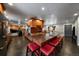 Spacious kitchen island with granite countertop and seating, open to the living room at 13464 W Virginia Dr, Lakewood, CO 80228