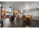 Open concept living area showcasing a kitchen island and dining space with a chandelier at 13464 W Virginia Dr, Lakewood, CO 80228