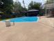 Backyard swimming pool with a gazebo and patio furniture at 13464 W Virginia Dr, Lakewood, CO 80228