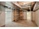 Unfinished basement area with shelving and additional rooms at 2771 W 38Th Ave, Denver, CO 80211