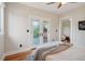 Bright bedroom with hardwood floors and French doors leading to a deck at 2771 W 38Th Ave, Denver, CO 80211