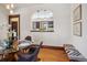 Spacious dining area showcasing hardwood floors, a pass-through to the kitchen, and stylish decor at 2771 W 38Th Ave, Denver, CO 80211